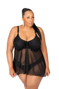 Woman wearing a black lace lingerie set on a white background
