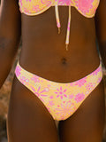 Sky bottom Anza swim briefs by Sun Bleached in pastel yellow with pink floral print.