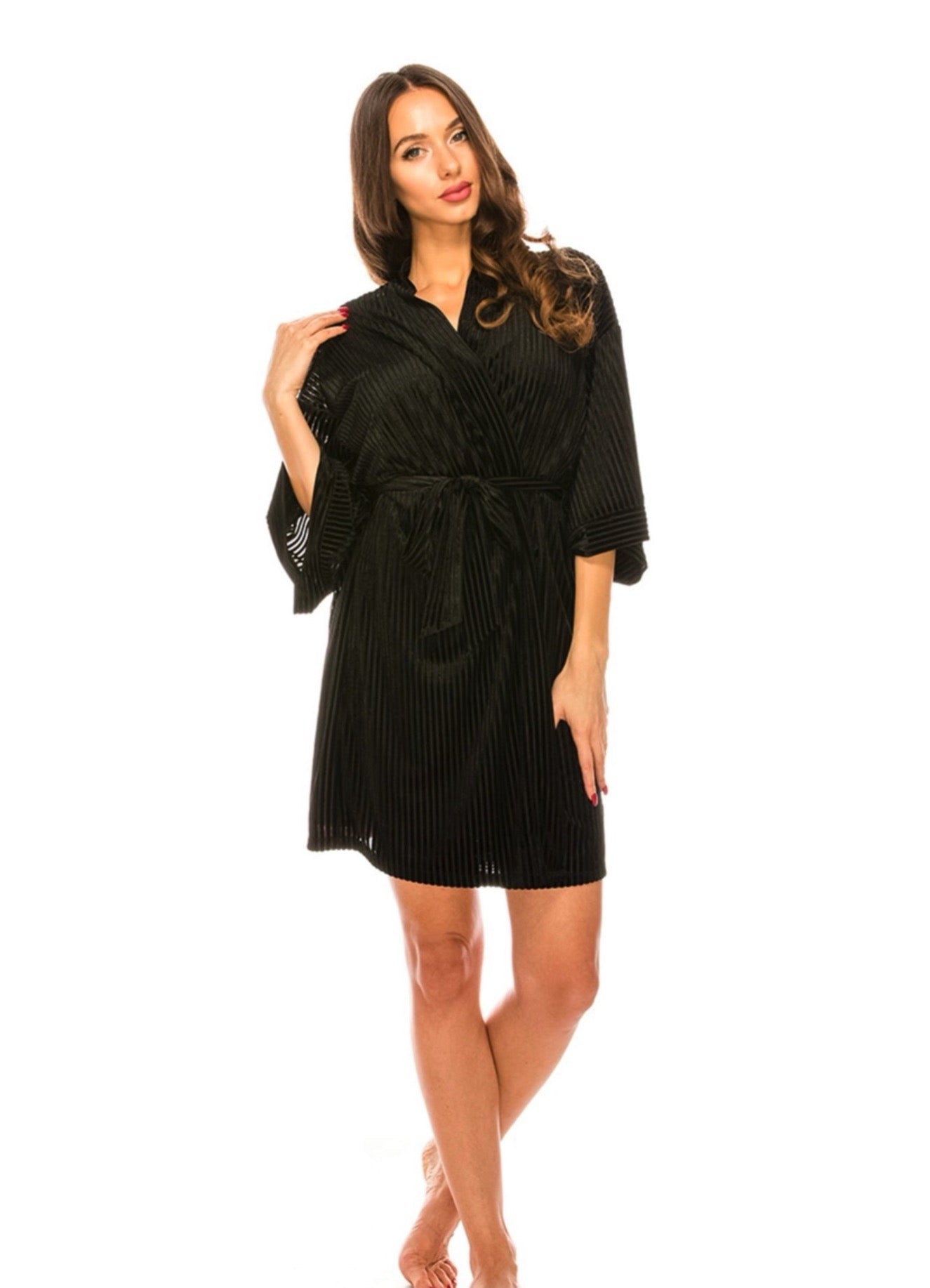 Woman wearing a black robe on a white background
